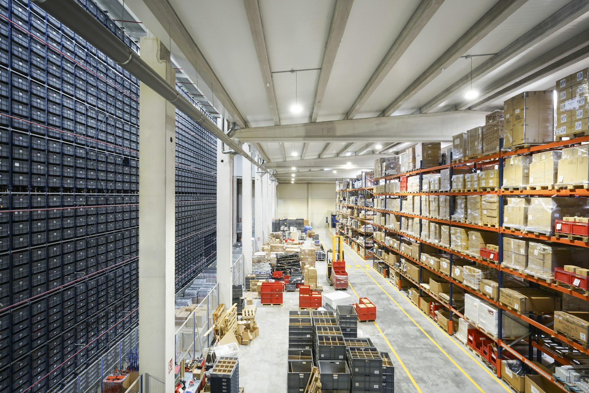 Interior of a large warehouse with racking and palletised goods