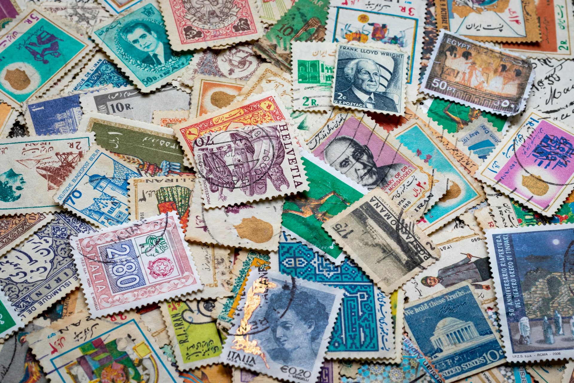 Pile of vintage postage stamps from a stamp collection