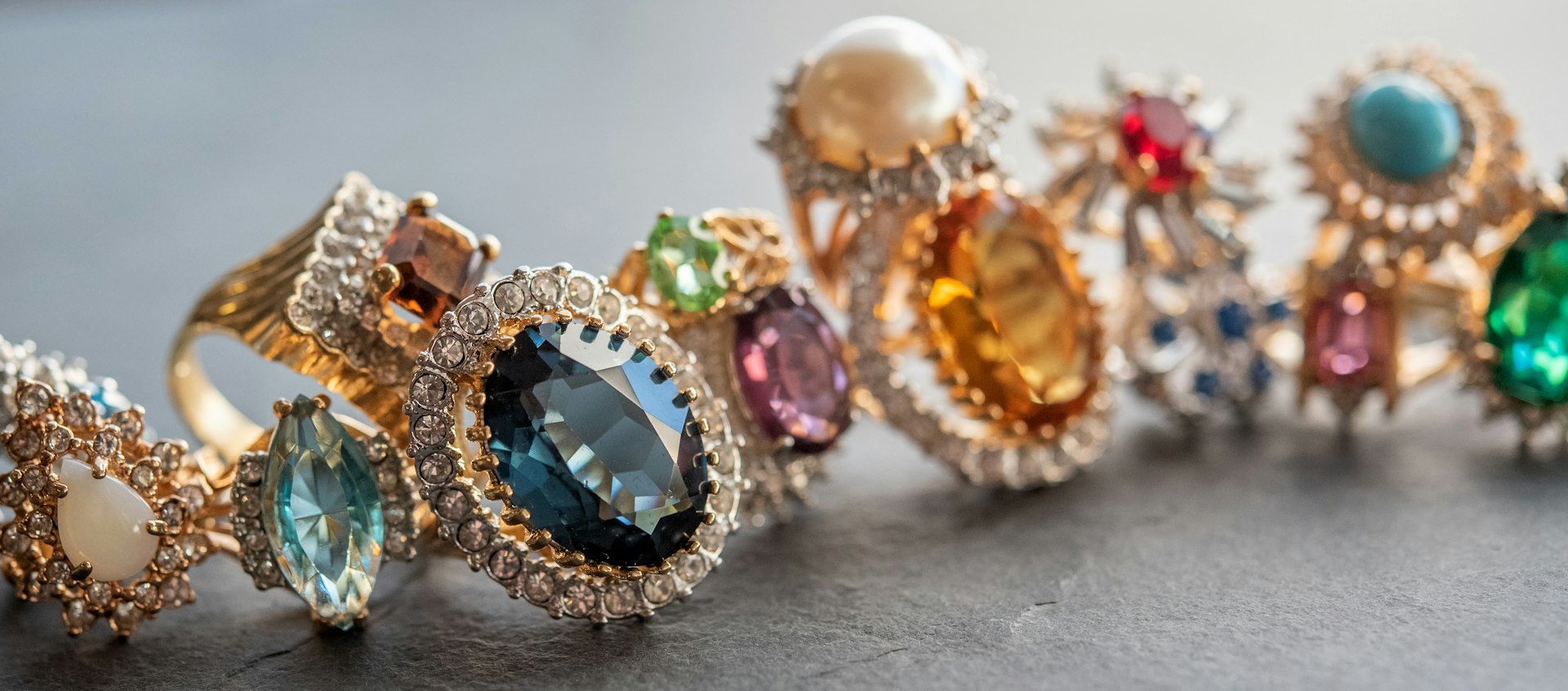 Row of vintage gemstone and diamond rings